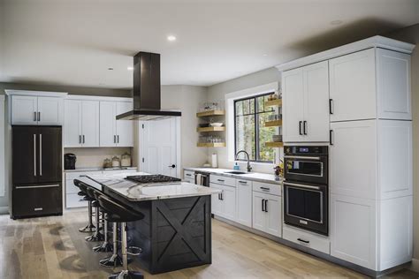 black stainless steel with white cabinets|white kitchen cabinets with black countertops.